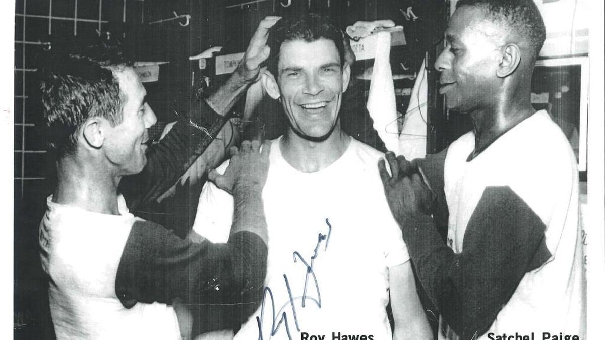 The big three in Miami’s 4-3 win over Havana swap praise in the Miami Marlin dressing room in 1956. Gus Niarhous (left) scored the winning run in the 11th inning on Roy Hawes’ (center) no out single with the bases loaded. And the pitching went to Satchel Paige (right).