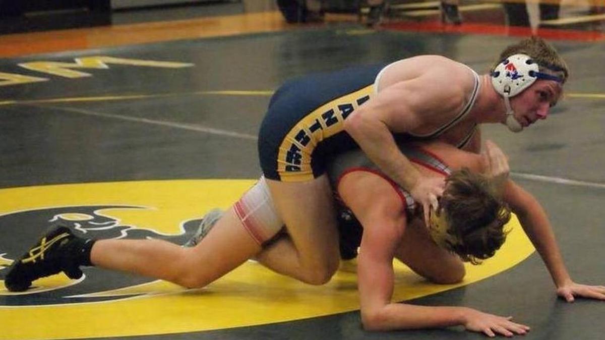 O’Fallon wrestler Jack Bond takes control of Highland’s Devin Wills en route to posting a 19-4 technical fall-victory in their 160-pound match in a triangular match at Highland High School last season.