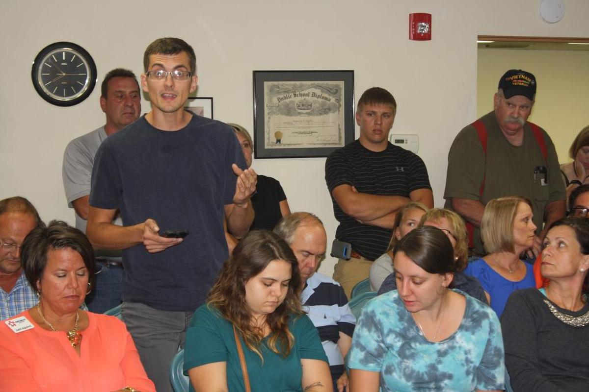 Shiloh resident Christopher Stroot of 1691 Cross St. voices concerns about luxury apartment developments planned for Shiloh at Monday’s village board meeting.