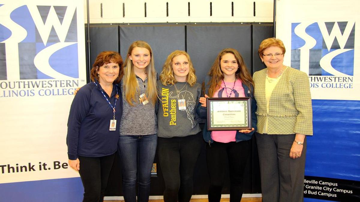 THIRD IN APPLICATIONS Pictured, from left, are OTHS team coach Julie Knutson; students, Amanda Hair, Janelle Vollmer and Jessica Hartmann; and SWIC Business Division Dean Janet Fontenot, Ed.D.