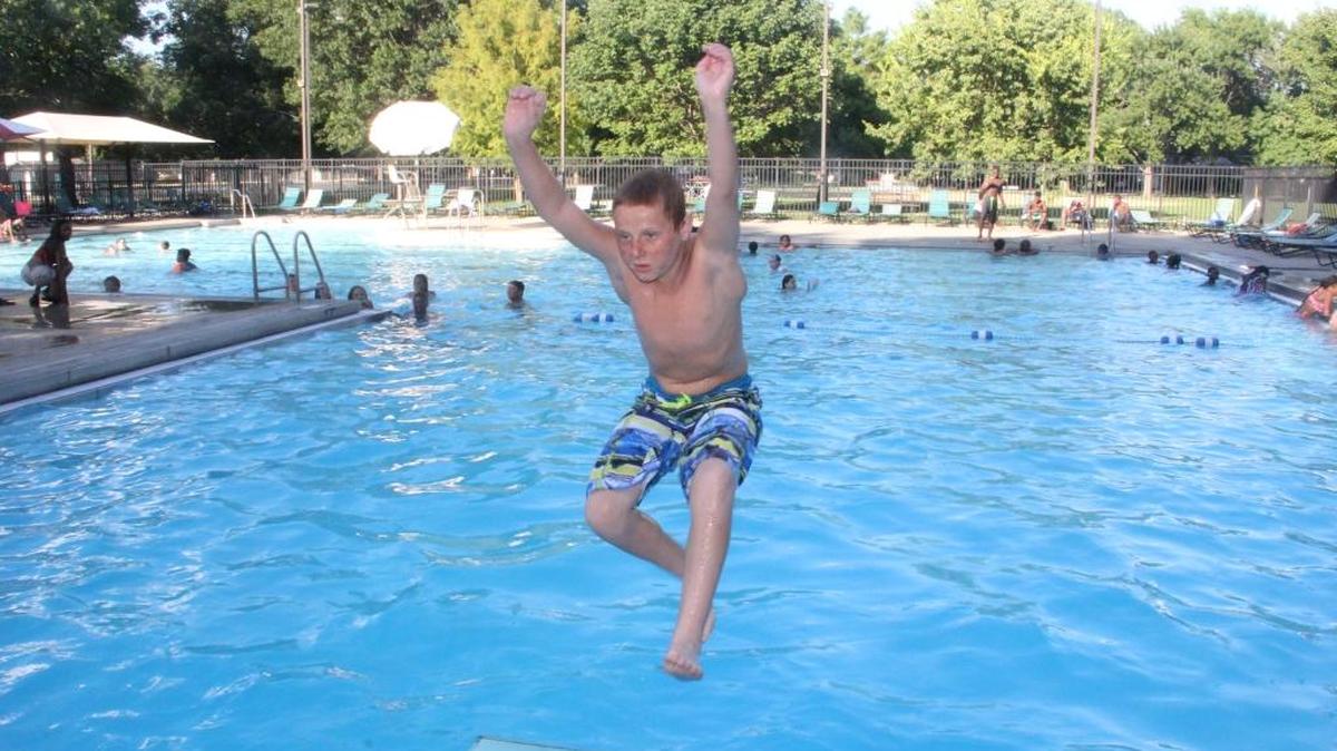 Riley Monroe of O’Fallon jumps into Memorial Pool located at O’Fallon Community Park on Monday night (July 11). O’Fallon hosted a free swim for both O’Fallon and Shiloh residents. The free swim night”was in celebration of July being named Park & Recreation month.