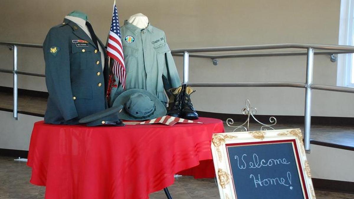 A display of a Vietnam jungle uniform and dress uniform that belong to Dennis Woltering, a member of the Vietnam Veterans Clinton County Chapter 269.