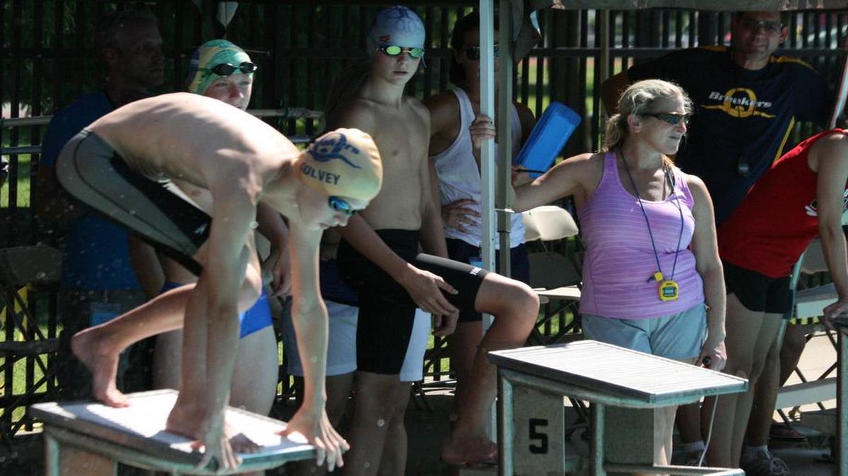 Breakers swimmer Nick Oulvey launches off the blocks for the 200 Free relay in last year's Midwest Conference Swim Meet.