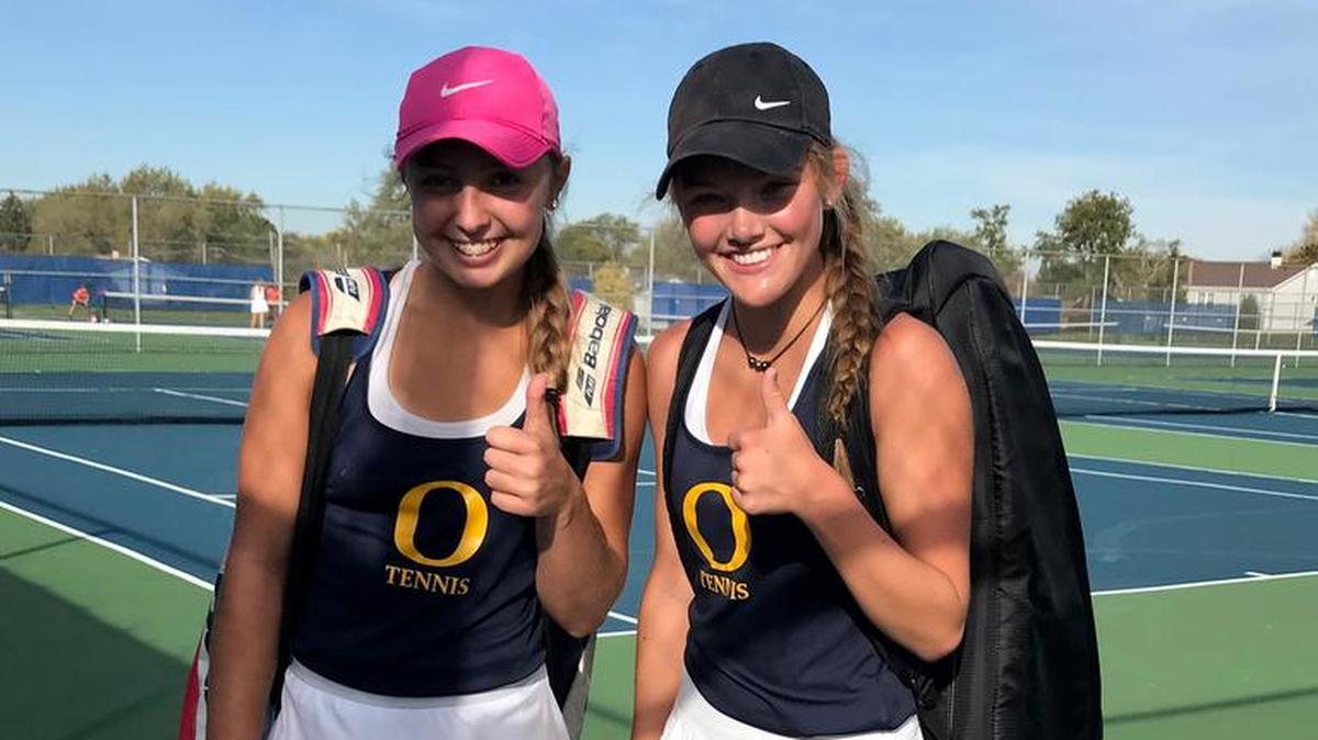 Kate Macaluso and Miley Brunner give a thumbs up while at the state tournament.
