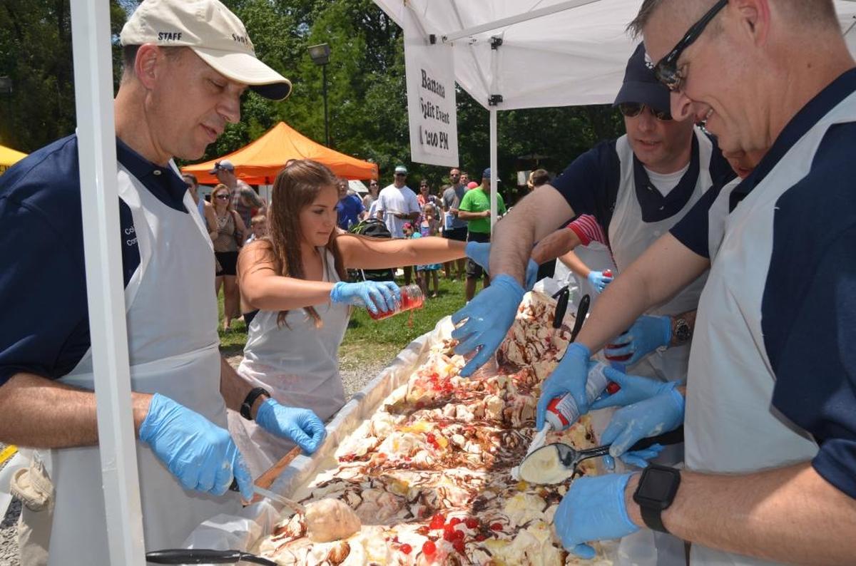 Scott Air Force base personnel along with Amanda Vernier make a 6-foot long banana split at the 22nd annual Salute to Scott picnic at O’Fallon Community Park in 2016. Former O’Fallon Alderman Ray Holden, who passed away in July at the age of 83, founded this event and also was a founding member of the Scott Field Heritage Air Park.