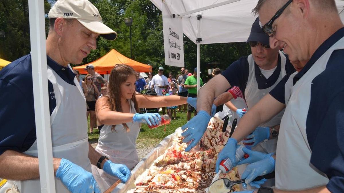 Scott Air Force base personnel along with Amanda Vernier make a 6-foot long banana split at the 22nd annual Salute to Scott picnic at O’Fallon Community Park in 2016. Former O’Fallon Alderman Ray Holden, who passed away in July at the age of 83, founded this event and also was a founding member of the Scott Field Heritage Air Park.