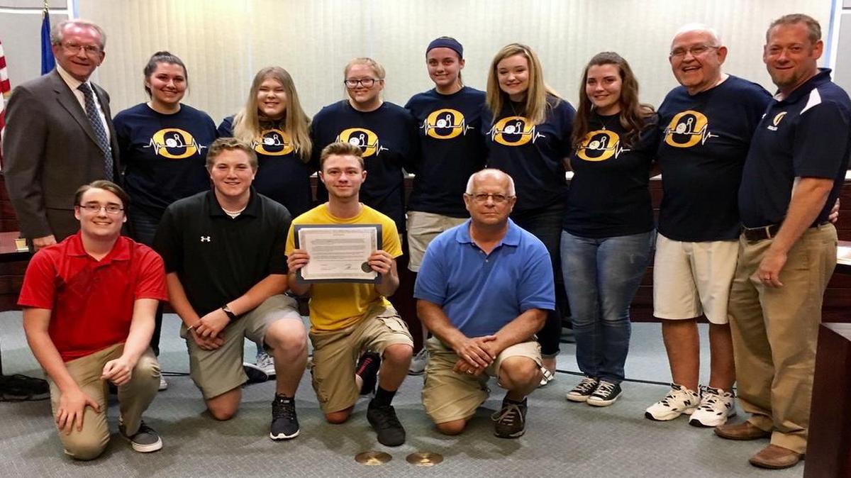 The O’Fallon Township High School boys and girls bowling teams were honored by the O’Fallon City Council during its Aug. 21 meeting. “We take this opportunity to congratulate this team on an outstanding performance throughout the year,” said Mayor Herb Roach. “We look with pride on these remarkable athletes and their consistent stellar performance, representing OTHS and the city of O’Fallon.” The OTHS girls and boys bowling teams each placed in the top five in the entire country, with the girls team placing fifth and the boys team placing third at the national tournament in Nashville, Tenn., on June 24-25. Front row from left are Donny Richards, Eli Rosenberg, Matthew Doyle, and boys head coach Mike Imes; back row, O’Fallon Mayor Herb Roach, Grace Braswell, Lauren Tomaszewski, Natalie Heltne, Mary Orf, Maddi Thornton, Hayleigh Williams, assistant coach Rich Williams, and girls head coach Gary Spencer.
