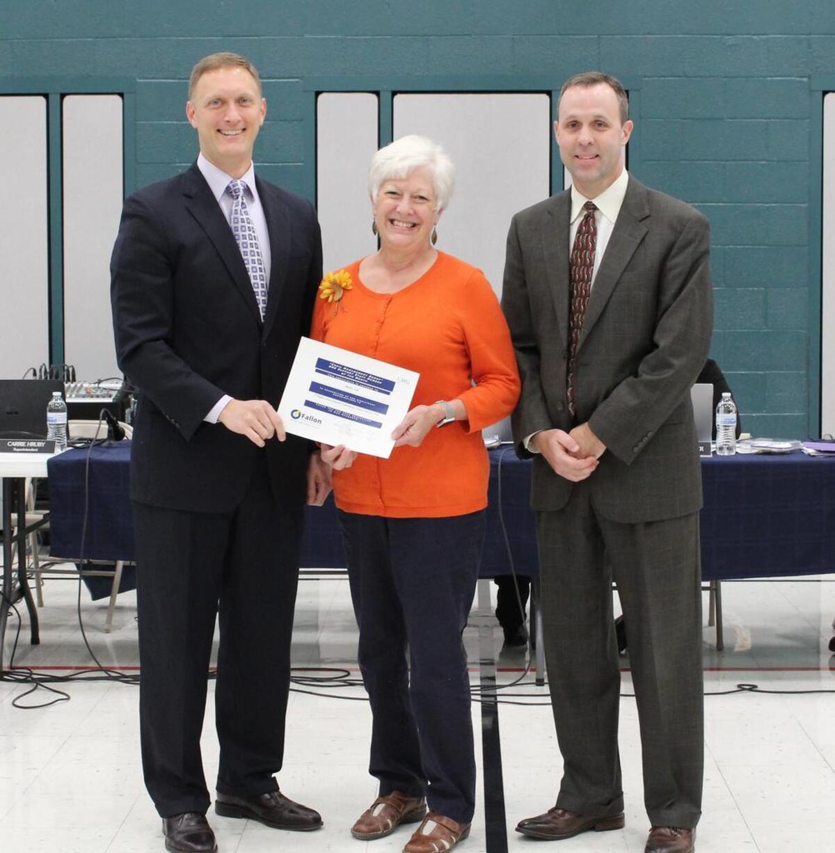 From left, O’Fallon School District 90 Board of Education President John Wagnon, Estelle Kampmeyer instructional aid Millie Erb and E.K. Principal Mark Dismukes during the November BOE meeting where Erb was recognized as the November Staff Member of the Month.