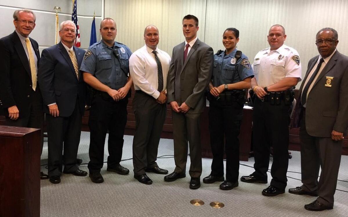 From left are Mayor Herb Roach; former alderman Gene McCoskey, now a member of the Board of Fire and Police Commissioners; Justin Ellis, George Fender, Nicholas Luttrell, Cloee Frank; Police Chief Eric Van Hook; and Horace Humphries, Board of Fire & Police Commissioners member.