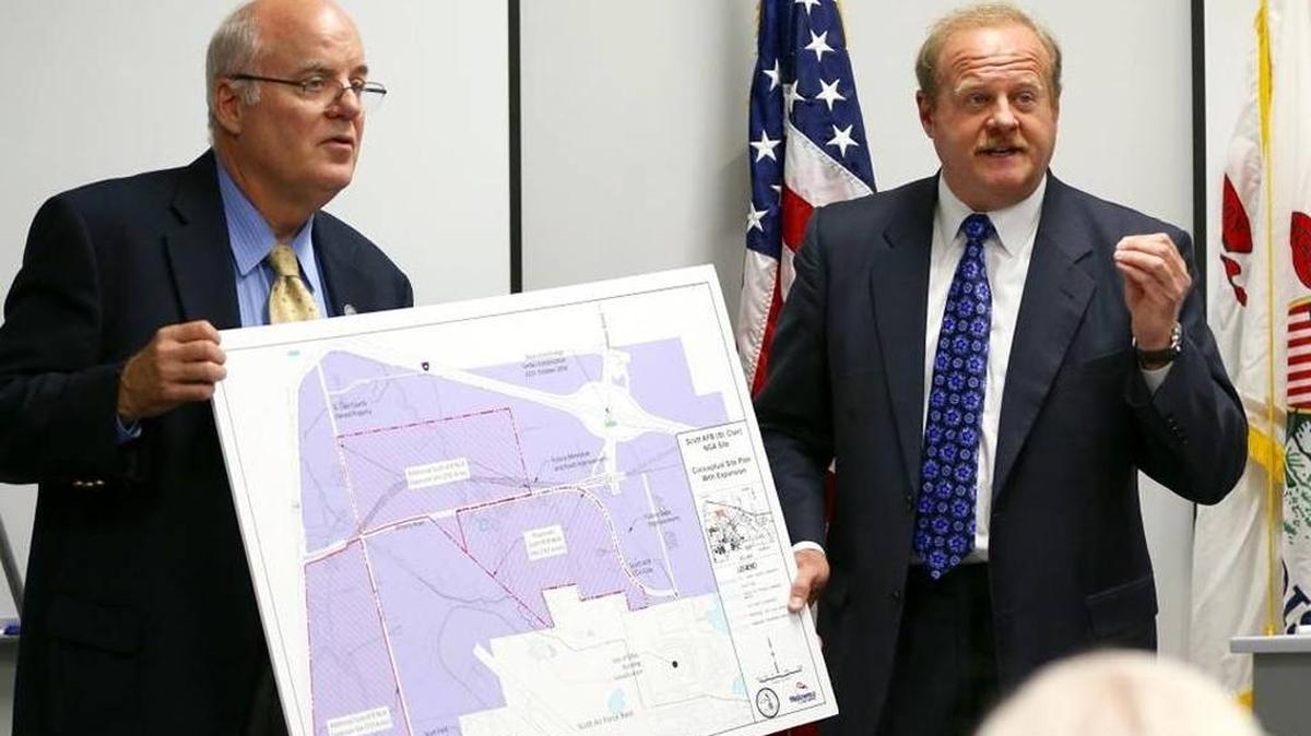 Madison County Board Chairman Alan Dunstan, left, and St. Clair County Chairman Mark Kern discuss advantages of the St. Clair County’s proposed site for the NGA’s West headquarters.