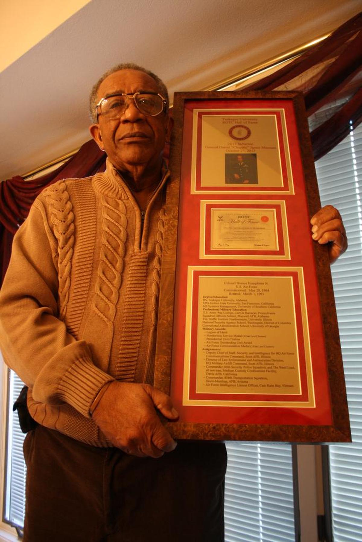 Retired USAF Col. Horace Humphries stands in his O’Fallon home with his 2017 Tuskegee University ROTC Hall of Fame Award he received on Oct. 27 at the General Daniel “Chappie” James Museum at Tuskegee University in Tuskegee, Ala.