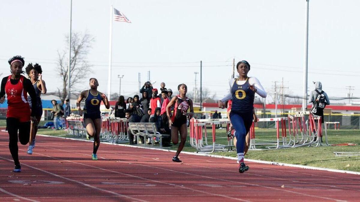 O’Fallon sprinters, in blue from left, senior Ally Foote, senior Kiya Scott, and junior Kiera Hollins compete in a meet on March 21 at Granite City.