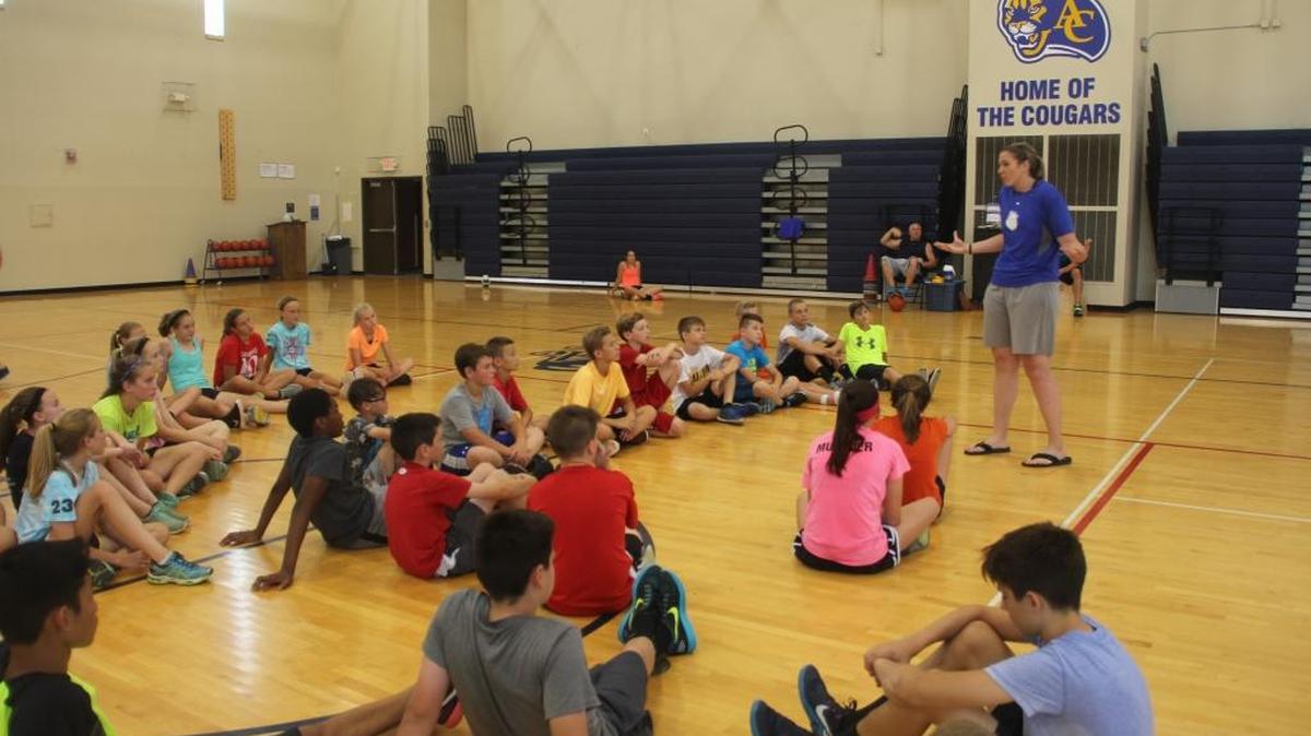 Hoop talk...Belleville East girls basketball coach Amanda Kemezys returned to her old stomping grounds Friday, when she talked to O’Fallon students who are currently attending a fitness camp held at Carriel Junior High School. Kemezys told the students about her recent trip to the Ukraine. A 2005 Belleville East graduate, Kemezys earlier played four years at St. Louis University before playing two years professionally in Lithuania. Prior to this season, Kemezys served as a volunteer assistant coach at East for two years. She had earlier coached seventh grade boys and eight grade girls basketball at Wolf Branch Middle School and at Carriel previously.