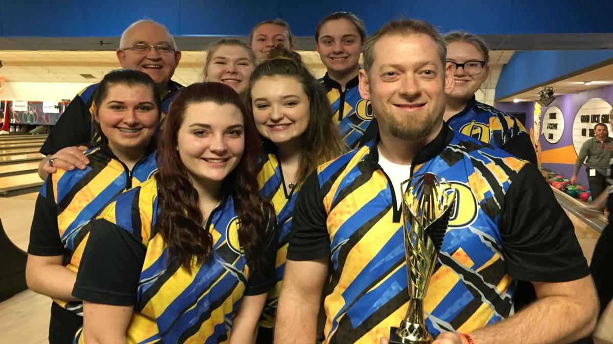 OTHS girls bowling team members huddle around coach Garrett Spencer after he won the Coach’s Challenge at the IHSA state bowling tournament in 2017. The 2020-21 Illinois high school sports season remains on hold due to the COVID-19 pandemic, but contact days could soon return for some IHSA activities.