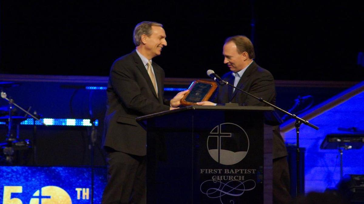 The O’Fallon First Baptist Church celebrates its 150-year anniversary in 2017. During a birthday celebration on Sunday, Jan. 29, left, Executive Director of the Illinois Baptist State Association, Nate Adams, presented a plaque to Pastor Doug Munton, current senior pastor at FBC.