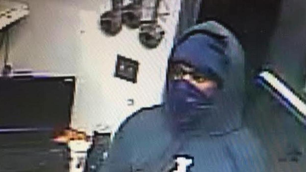 Security camera footage shows the armed robbery suspect at 6:02 a.m.