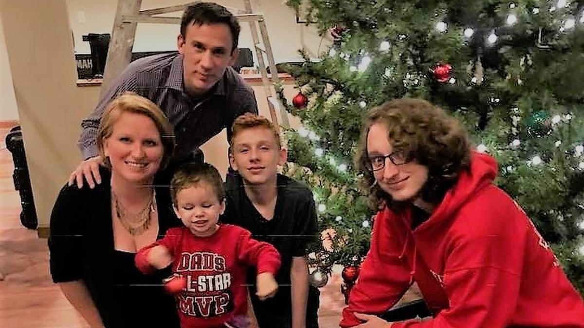 The Ortega family around their Christmas tree.