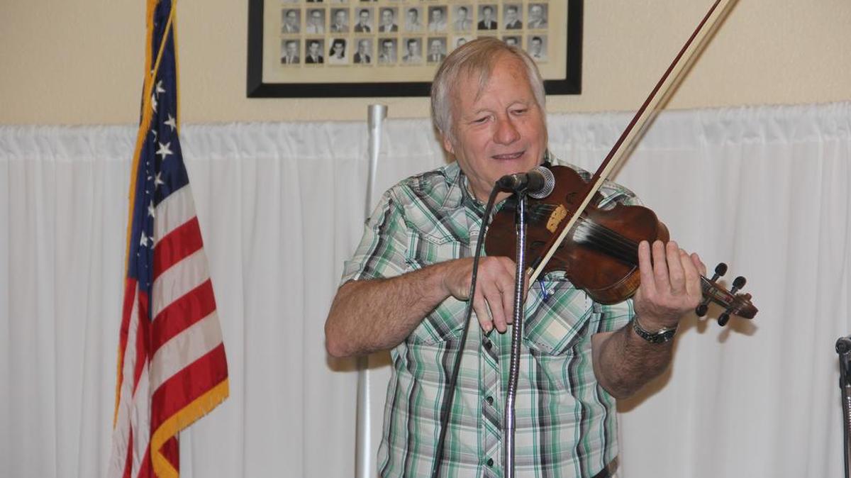 George Portz plays his fiddle at his 37th Annual Fiddle Contest and Bluegrass Show in O’Fallon.