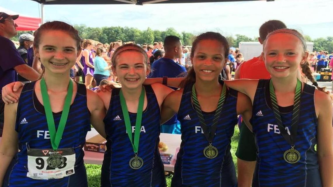 From left, First Baptist Academy Junior High girls track Malia Fallin, Maggie Spriggs, Hailey Resper, and Lizzy Crowe.