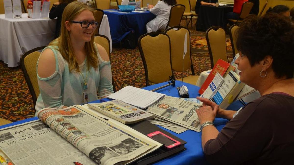 Natalie Heltne, an eighth grader from Fulton Junior High School in O’Fallon visits with Progress-Belleville News Democrat advertising sales representative Patti Klepac at the O’Fallon-Shiloh Chamber of Commerce Career Fair.