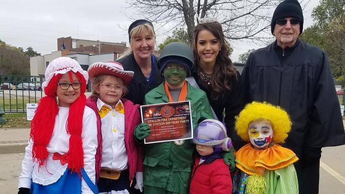 The Seipp Family float took first place in the Grand Prize category of the costume contest on Saturday, Oct. 28 during the 2017 Annual O’Fallon Rotary Club Children’s Halloween Parade and Downtown Pumpkin Patch event. Back row from left, contest judge Shelly Severns, Miss O’Fallon Ava Hipskind and contest judge Ed True. , holds From left, Ella Hohnsben aka Raggedy Ann, Drew Buchler aka Jessie cowgirl, Landon Dippel, aka army soldier, Mason Santiago aka Buzz Lightyear, and Gage Spengler aka clown.