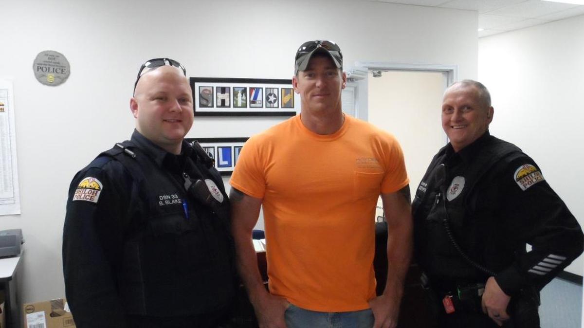 On Friday, Dec. 2, Terry Lewis, construction worker who was electrocuted on Oct. 7 and saved by Shiloh Police Officers (left) Bradley Blake and (far right) Mark Geyer, visited the Shiloh PD to meet and thank his heroes who saved his life.