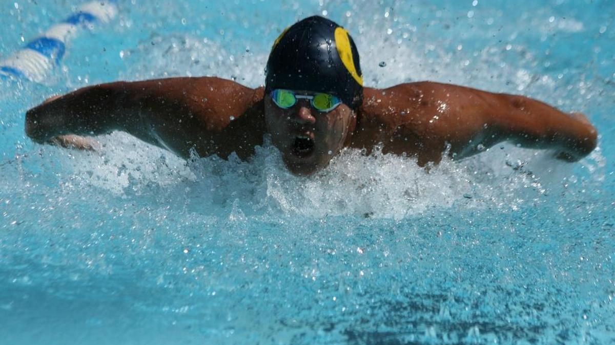 Breakers swimmer Marcus Quinlan swims the 50-meter butterfly in the Midwest Swim Conference Meet last Saturday at O'Fallon Pool. O'Fallon finished second in the 10-team field.