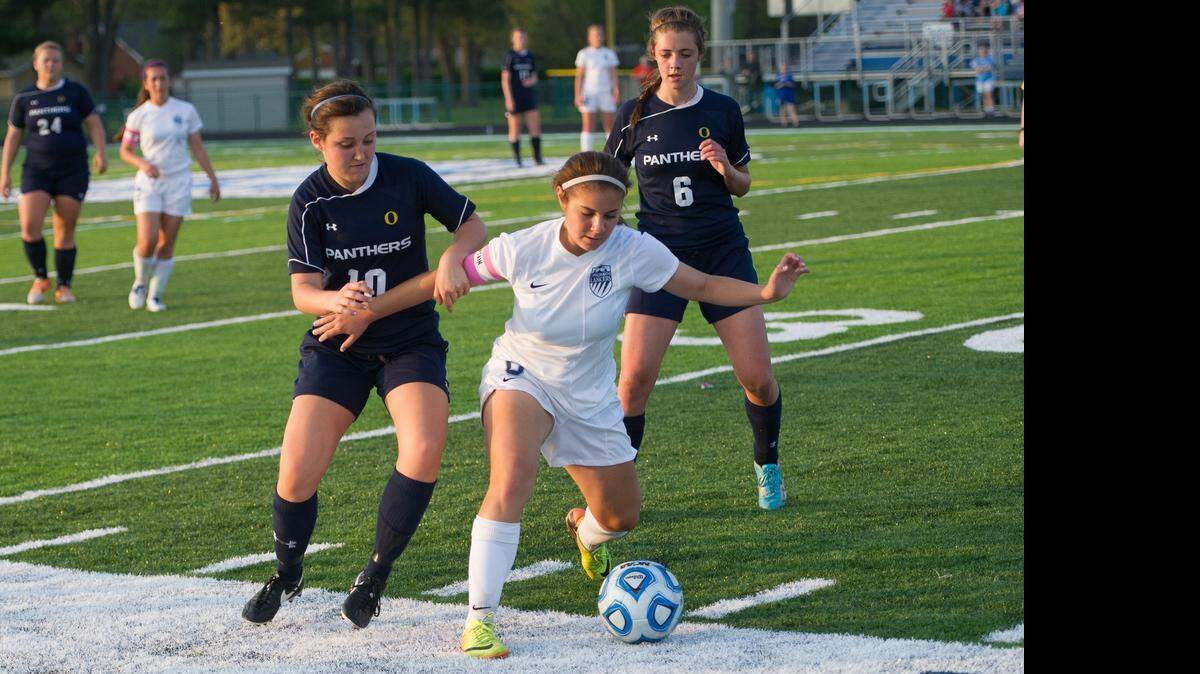 
O’Fallon’s Andrea Wieman, 10, and Kayla Wood, 6, zero in on a Belleville East player during the 0-0 stalemate between the two squads.
