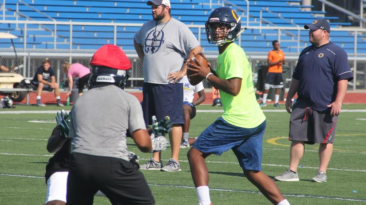 O’Fallon quarterback Chris Perez looks for a receiver during Tuesday’s practice. Perez, who is just a junior, made his varsity debut a year ago as a sophomore a year ago and passed for 487 yards. He might have even a bigger year this fall.