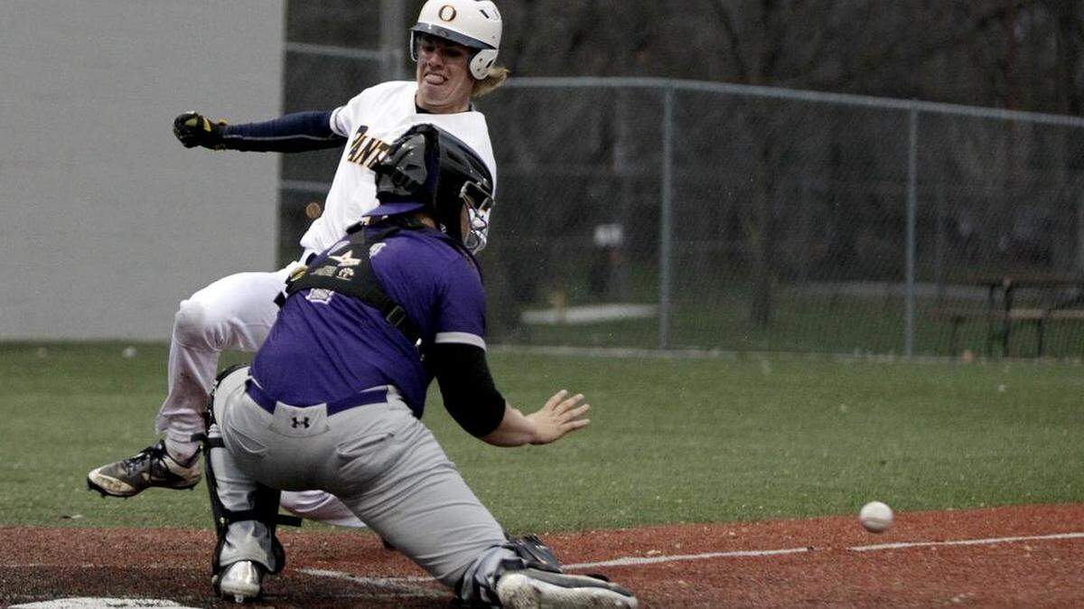 O'Fallon's Quinn Lowery slides safely into home in the Panthers' 13-3 win over Collinsville on April 3.