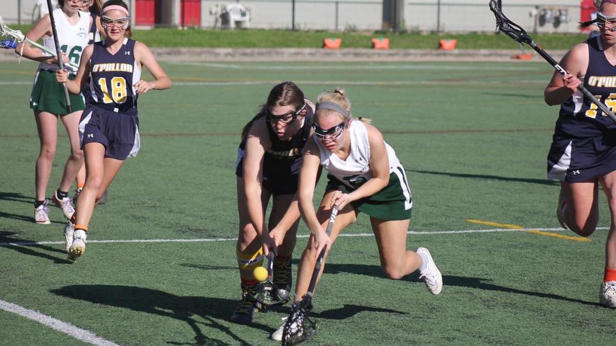 Jenn Greene battles a Nerinx Hall defender for a loose ball in action earlier this year.
