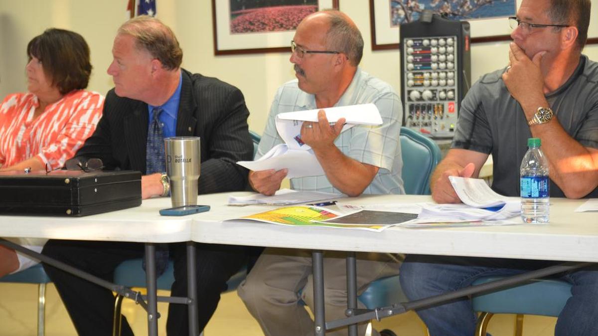 From left, Shiloh Village Trustee Colleen Powers, Terry Bruckert, village attorney, Mayor Jim Vernier, and Trustee Greg O’Neil.