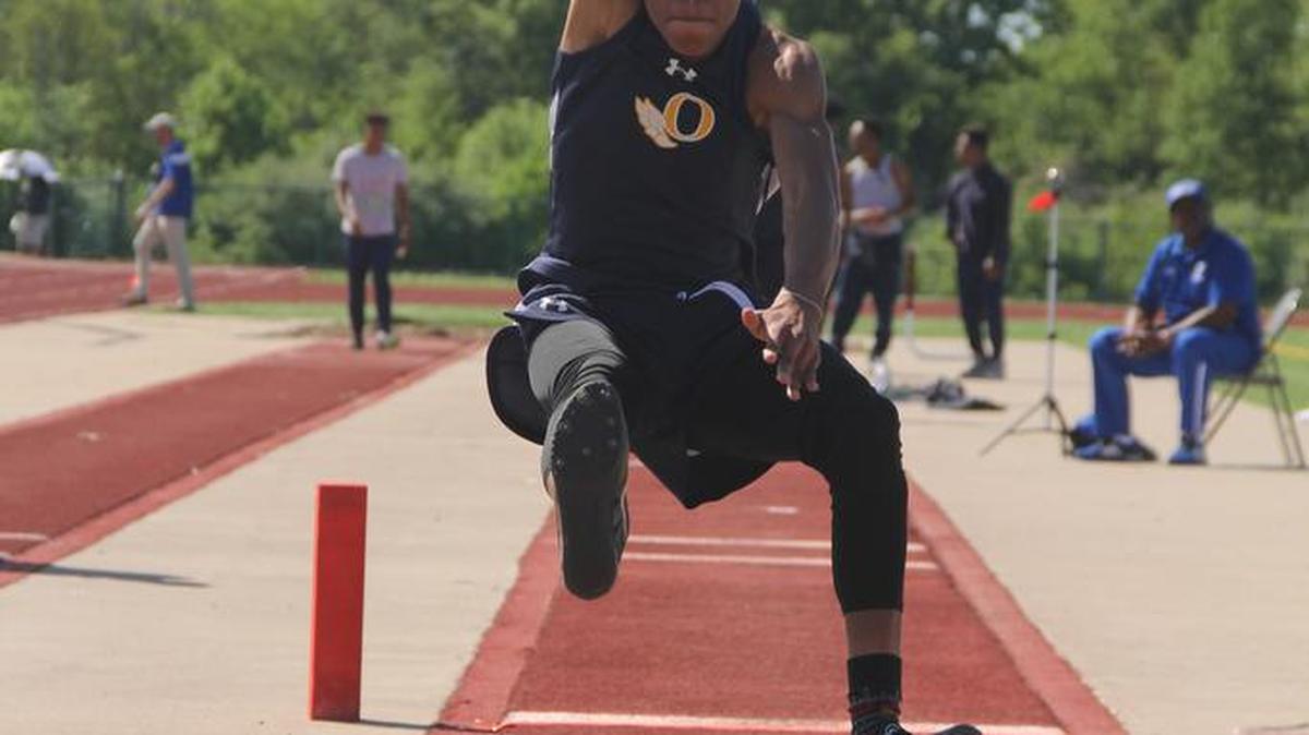 O'Fallon's Shawn Spires competes in the long jump at the St. Clair County Relays.