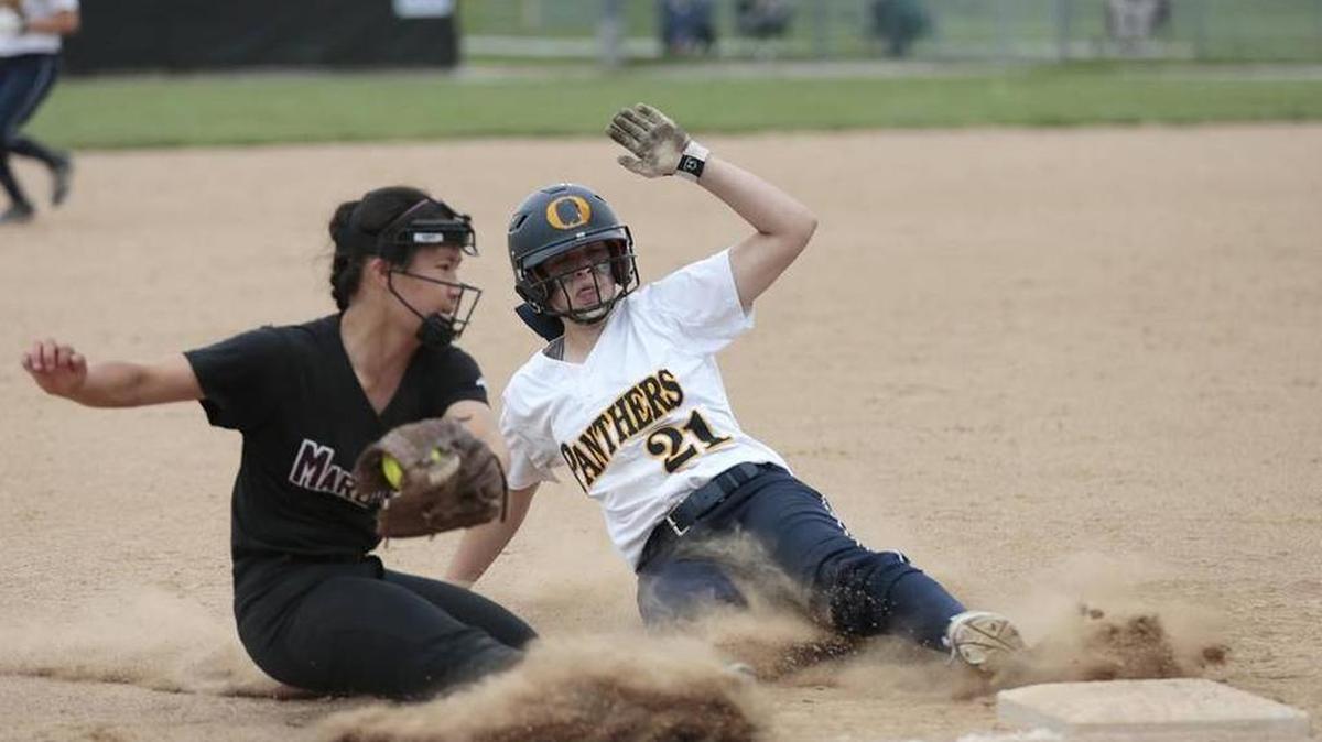 O'Fallon's Ginger Huskey slides safely onto third base past Belleville West's Kiri Evans during their game on Tuesday.