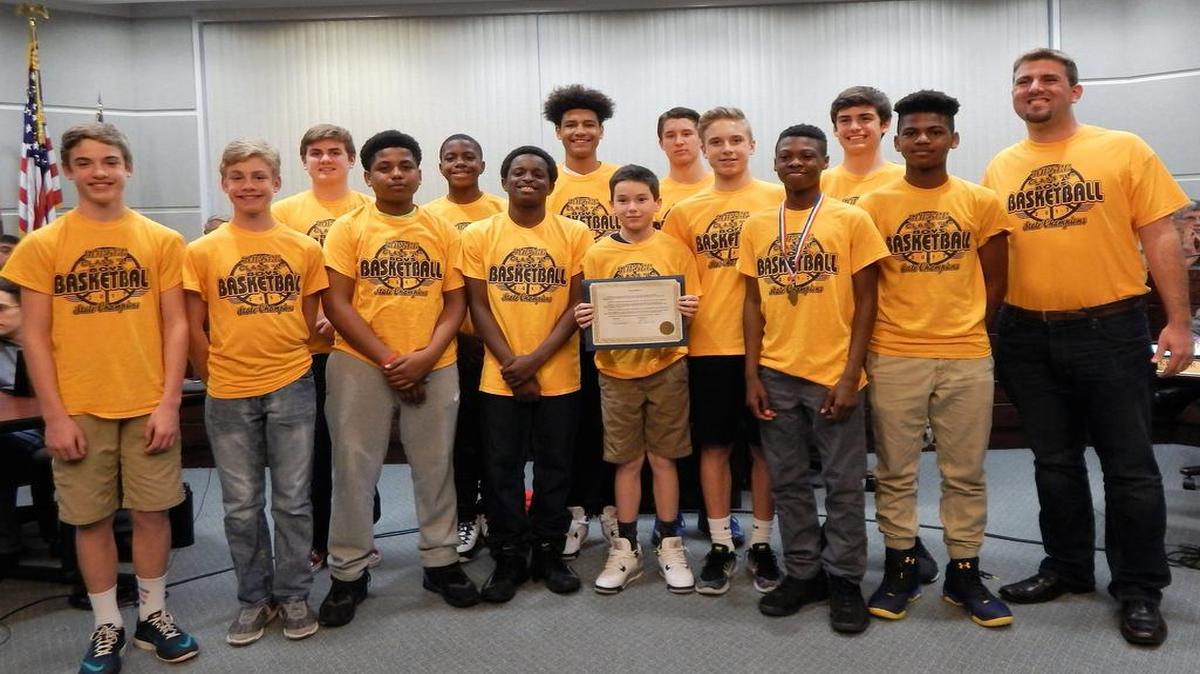 Members of the 2017 Carriel Junior High boys basketball team were honored by the O’Fallon City Council. From left are Joe Novy, Nick Novy, Trent Zimmerman, Jaden Howliet, Dakari Sayles, Donavan Whitfield, Shaun Riley, Graydon Cornell, Kaden Joggerst, Clay Adams, Chris Chipman, Kendall Walter, Caleb Burton, and coach Chris Hursey, Not pictured are Keelen Allen, Judah Ezinwa and Roderick Williams.