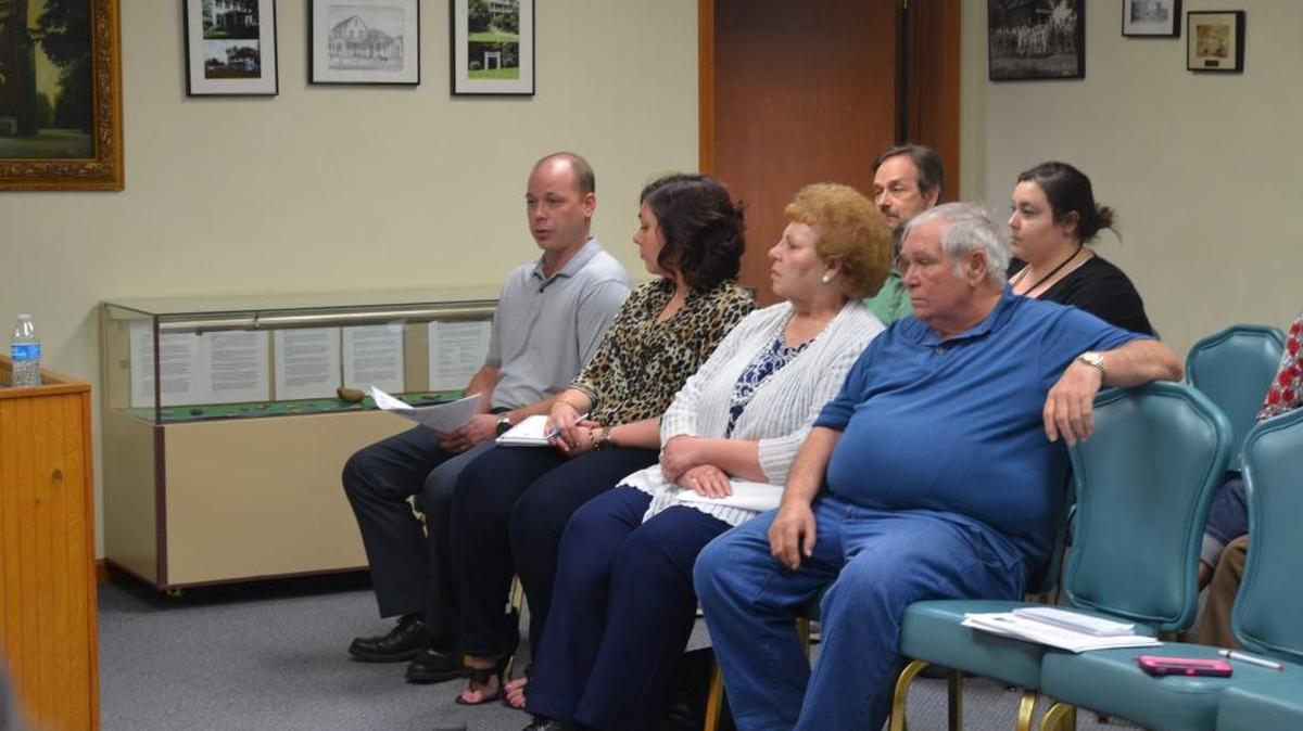 From left, Mark and Jennifer Richardson, Eyvone and Allen Klein address the Village of Shiloh Board of Trustees Monday to inquire about the possible renaming of thier family’s private road K & K Lane, which stands for ‘Klein & Klucker’ Lane.