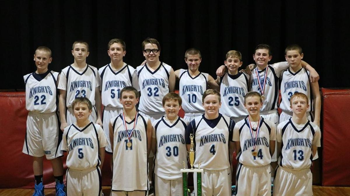 On Wednesday, Dec. 30, the O’Fallon St. Clare Catholic School Eighth Grade Boys became St. Peter and Paul Catholic School Holiday Tournament champs, winning 32-22, against St. James Catholic School’s team from Millstadt.