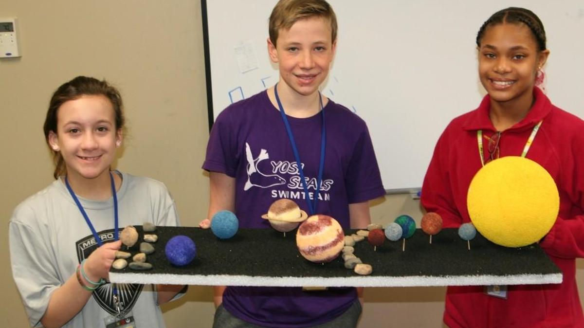The sixth graders in Allyson Otey’s class, at First Baptist Academy have been off in space exploring the amazing solar system by making their own models. Pictured, Reagan Parker, Michael Stooke and Laila Sims show off their model.