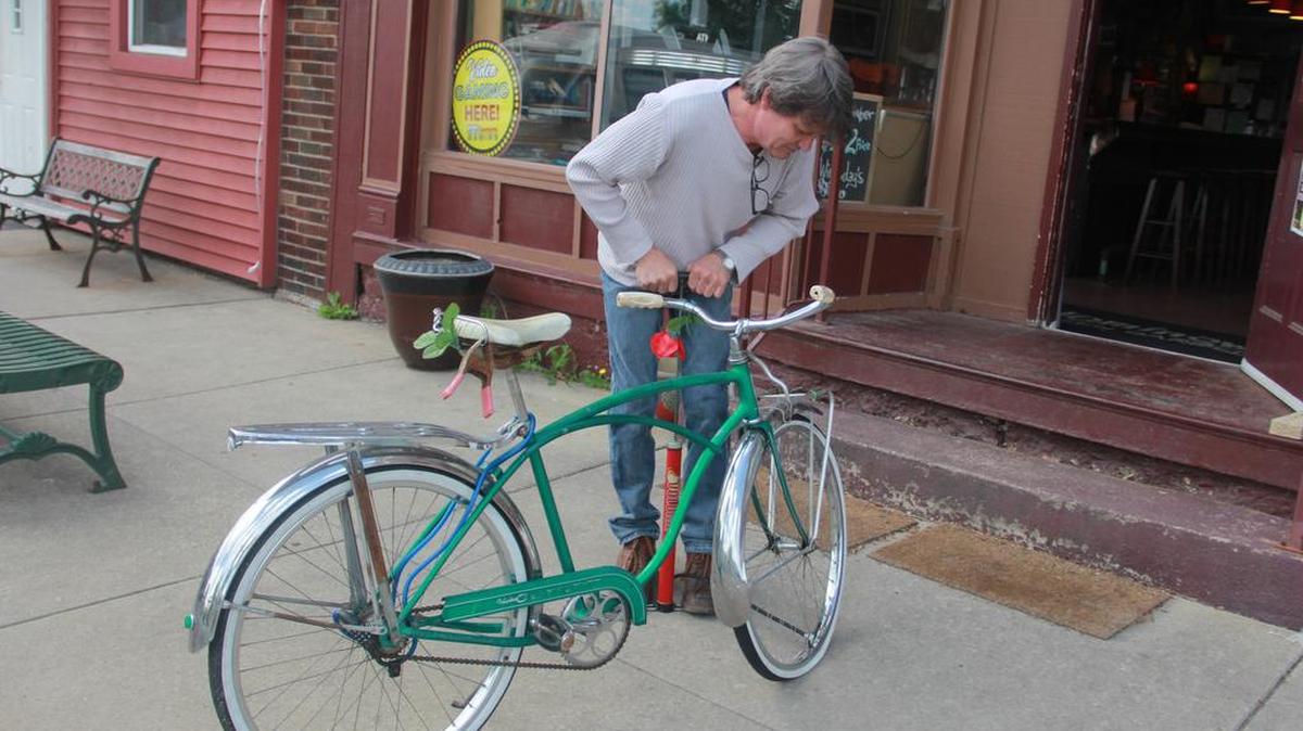 With warmer weather on the way, Mike Smith of O’Fallon pumps up his bike tires Tuesday morning. Temperatures are expected to warm up Saturday to the lows 80s. But there is chance of rain on Sunday. More rain is expected early next week with a chance of storms on Monday and Tuesday.