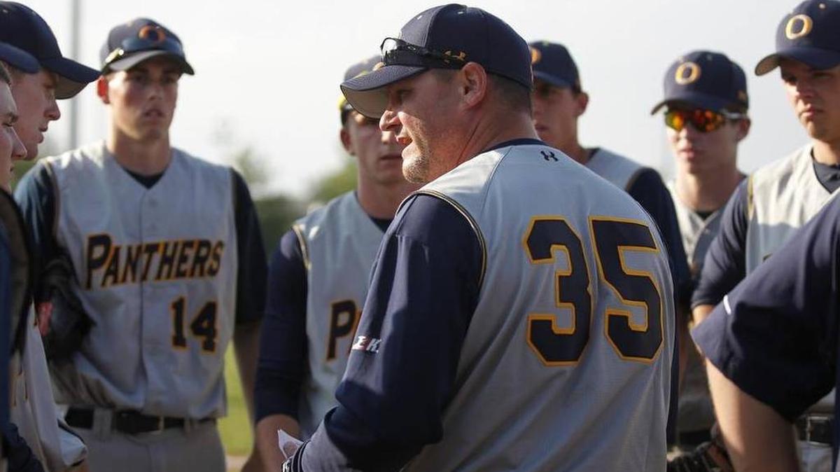 O'Fallon head coach Jason Portz talks to his players during their game against Edwardsville.