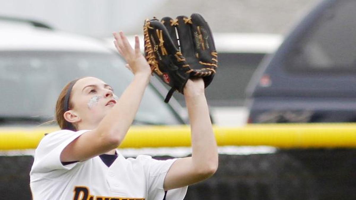 O'Fallon's Courtney Keller reaches for a fly ball during a game against Belleville West.