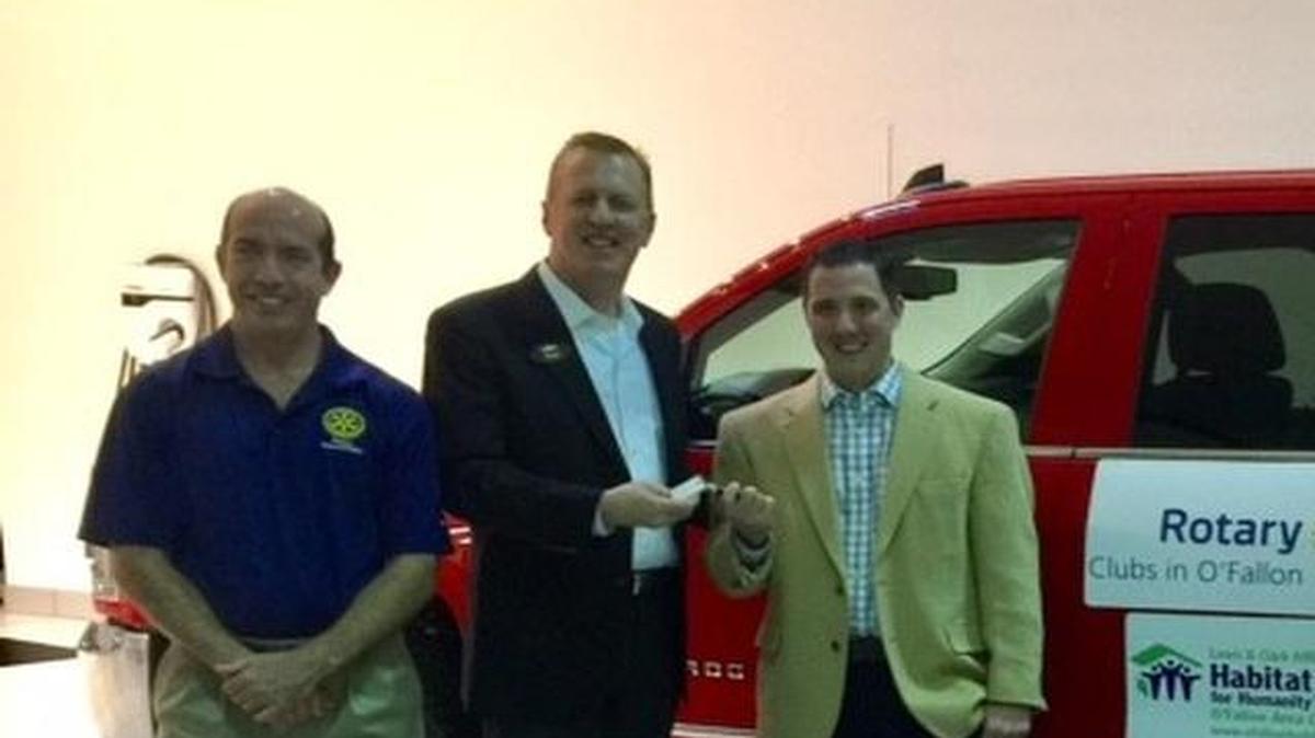 Getting the keys to his new ride, Matt Warchol was the winner of a Jack Schmitt Chevrolet Silverado raffled by the Rotary Clubs in O’Fallon to support the Lewis and Clark Habitat for Humanity O’Fallon chapter.