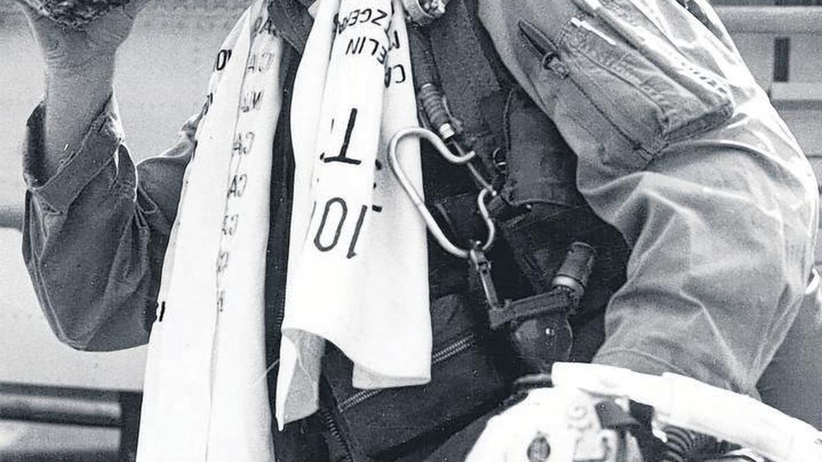 Phil Goodwin celebrated after flying his 100th mission in North Vietnam by drinking juice from a pineapple.