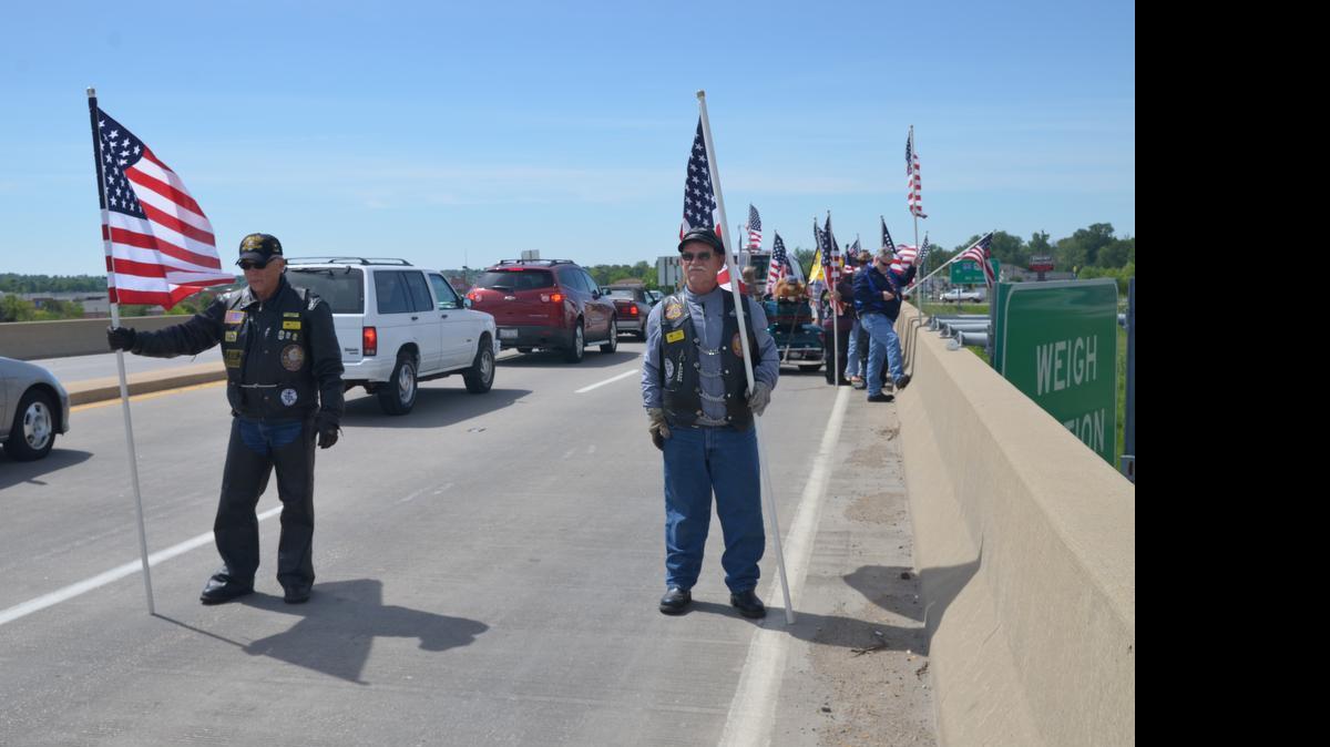 
Left, Frederic Smith, of Alton, stands with Wayne Schmidt, right, and fellow members of the Illinois Patriot Guard Riders on the O’Fallon I-64 overpass. The riders wait in anticipation for the Rolling Thunder riders, a group comprised of hundreds of motorcycle riders traveling from California to Washington, D.C., in honor of our country’s United States Veterans. 

