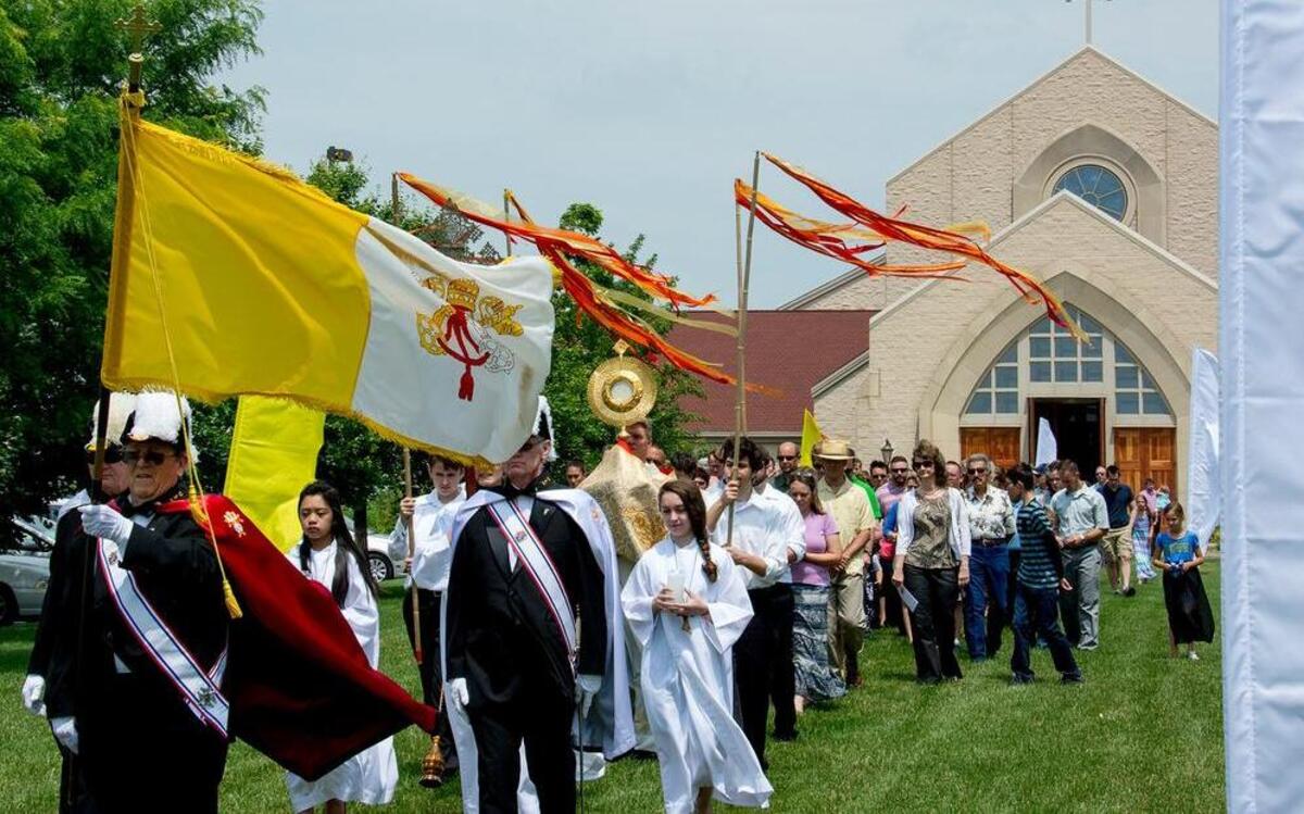 Members of St. Clare of Assisi Parish in O’Fallon process from the church in a Eucharistic Procession to celebrate the Feast of Corpus Christi. This year’s celebration will take place at 11:45 a.m. Sunday at St. Clare Church, 1411 Cross St., O’Fallon.