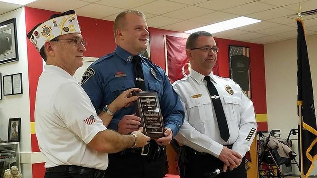 O’Fallon Veterans of Foreign Wars Post 805 Commander Ed Martinez awards O’Fallon Police Officer Clay Hoff with the VFW National Law Enforcement Public Service Citation Award during the annual VFW First Responder Award Banquet. O’Fallon Police Lt. Rob Schmidtke stands far right.