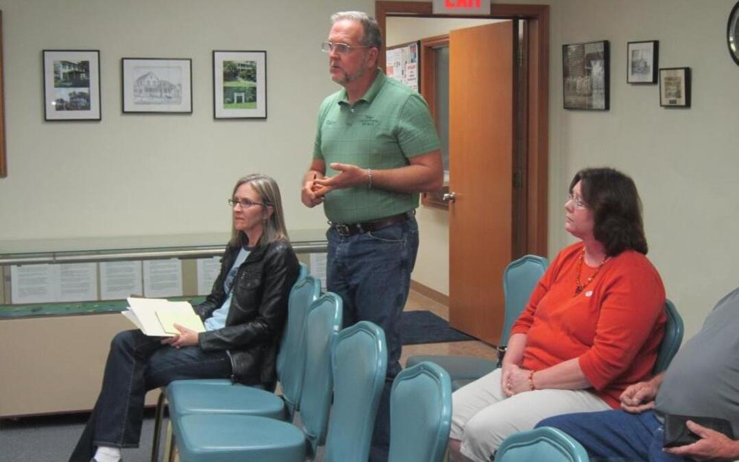 Standing is Roger Rodney, resident on Archview Drive in Meadowbrück Lake Estates, appealing to the Shiloh Board of Trustees Monday night to consider not allowing a connecting thoroughfare be opened to the Summit of Shiloh proposed subdivision due to heightened safety concerns. Marilyn Almind, Meadowbrück Lake Estates homeowner’s association president, is sitting behind Rodney.