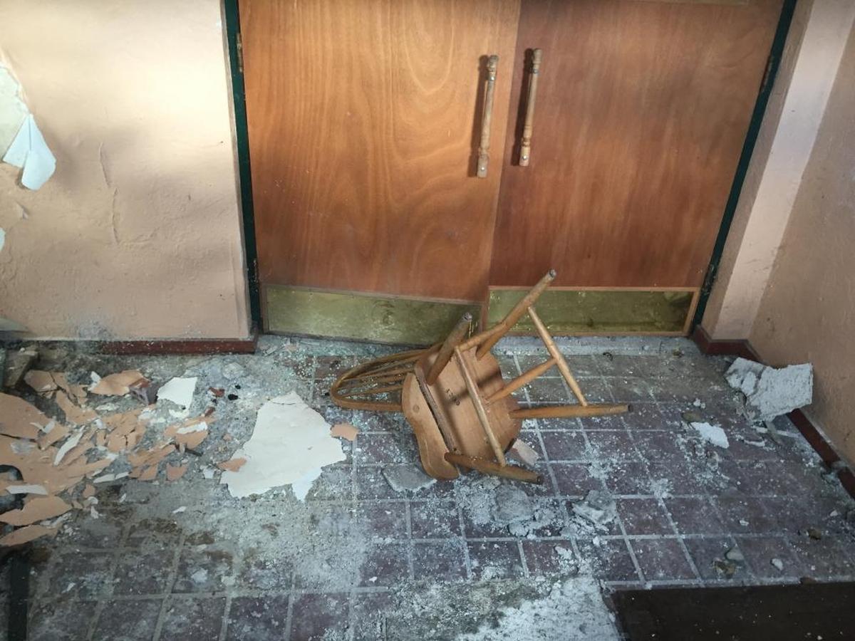 In 2016, this was the view through the broken front door window before more boarding was added at the village-owned Red Barn, 2400 Country Lane in Shiloh. Extensive water, mold and roof damage, as well as vandalism contributed to the structures poor shape.