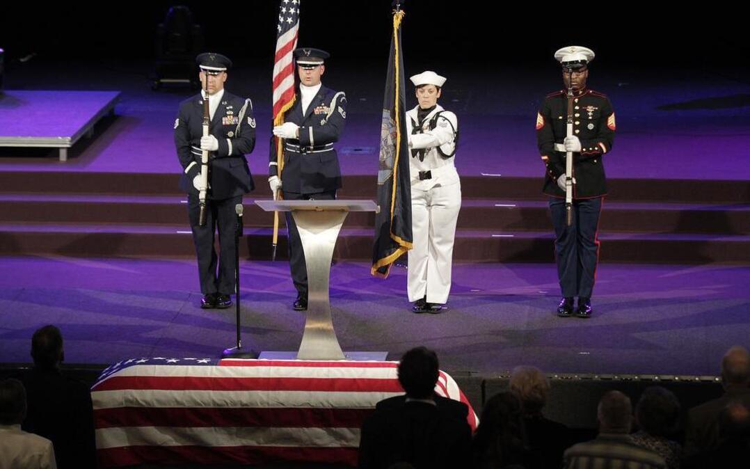 A military honor guard posts the colors to begin the memorial service for U.S. Navy Seaman 1st Class Robert Temple, who died during the bombing of Pearl Harbor in 1941. His remains were recently identified due to advancements in DNA technology. The memorial service was held at the Faith Family Church in Shiloh on Saturday morning, with Temple's nephew Pastor John Temple officiating and delivering the eulogy. Seaman Temple's remains will be buried in Hawaii.