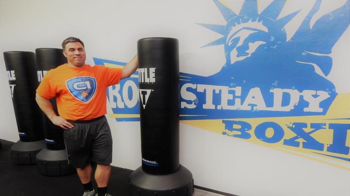 Chris Gilbert next to the Rock Steady Boxing equipment, a new program geared to help people with Parkinson’s disease.